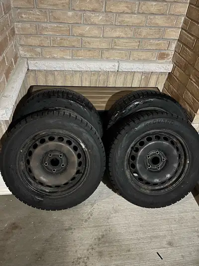 Used set of Four (4) Winter Tires and VW Rims. Yokohama Ice Guard IG53 tires - Size 215/60/16 Remain...