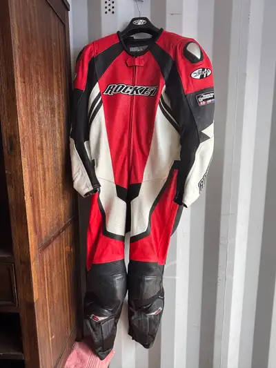 I am selling a Joe Rocket one piece motorcycle racing suit, size 46. It is red, white, and black lea...