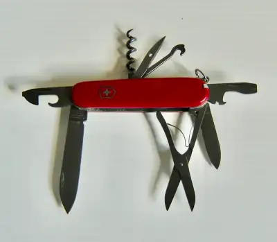 This is a classic Victorinox Swiss Army Climber camping pocket knife that has 14 useful functions. T...