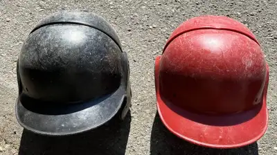 Pair of vintage Cooper BC1000 baseball/softball batting helmets, View more