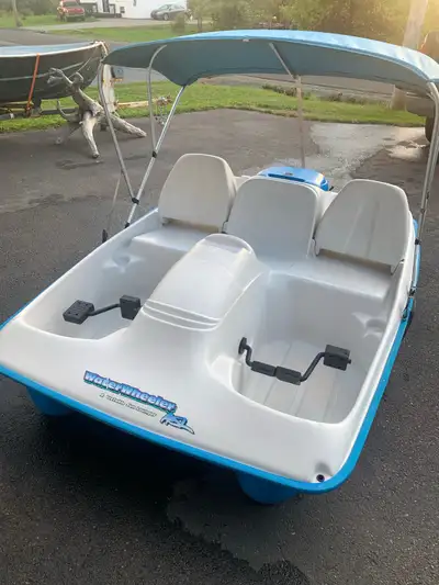 Water Wheeler ASL electric pedal boat. Comes with built in electric motor, marine deep cycle battery...