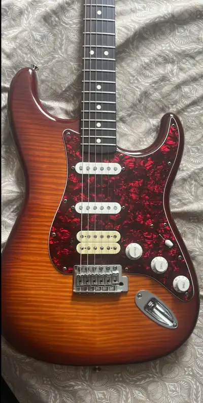 Hey I have a nice Mexican fender strat. Plays and looks amazing the humbucker really makes it sing!...