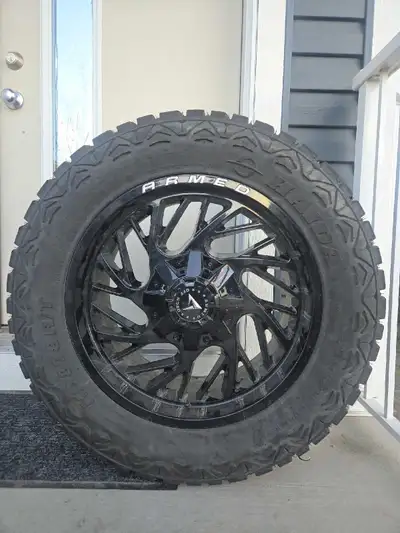 Selling like new 20 inch rims 33 inch tires only ran 1 season and where also taken off for the winte...