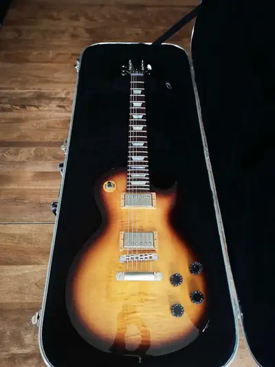 Rare. Desert burst finish. Includes original hard case. Has satin/matte chrome hardware. Tuners upgr...
