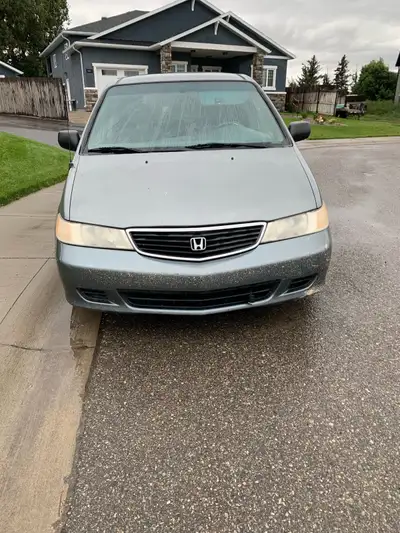 2001 Honda Odessey, V-6 power train in good condition. Some rust and some hail damage, but a very go...
