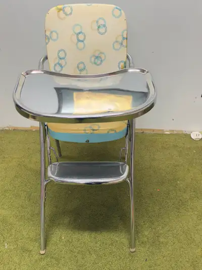 Check out this fantastic vintage high chair from the 1950s! This stainless steel beauty is not only...