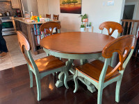 Round kitchen table with 4 chairs.  Good condition