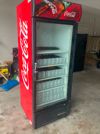 Commercial beverage cooler (True Brand) CocaCola decals.