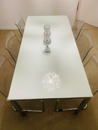 IKEA 6 Seater Dining Set. Glass top table & transparent chairs.
