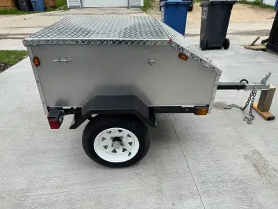 For sale I have a small utility trailer. Box size is approximately 4 feet x 4 feet x 18 inches high....