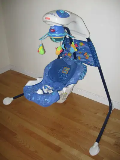 Balançoire musicale bleue Aquarium Fisher Price en bon état, View more