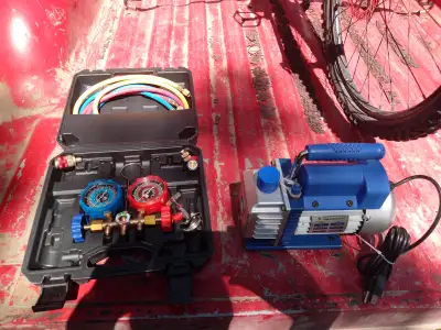 Ac evacuation vaccum pump, used once comes with pump oil