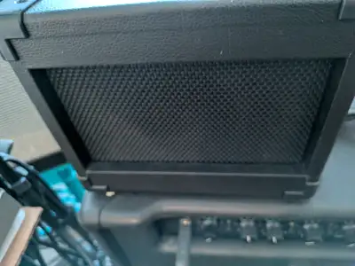 Tiny amp battery run or AC great for on the road etc. It's new. Produces 4 watts of power. Sell for...