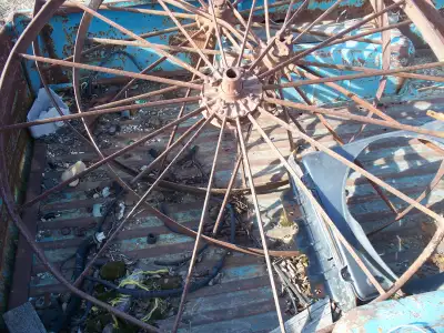 Steel wheels, 50” in diameter (3), One from John Deere dump rake, two from John Deere side rake; can...
