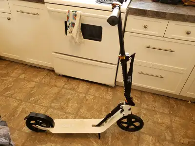Hudora Adult Kick Scooter. Used twice. It is foldable and has a carry strap. Has a carry weight of 2...