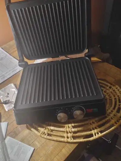Panini press also can be a grill. Bought a month ago, a couple small scratches on the bottom grill.