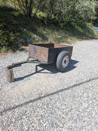 Utility trailer for your ATV. Home made (not by me) welded steel construction. Removable tailgate an...