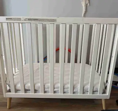 Selling amini crib, comes with mattress, mattress waterproof cover and sheets. Two settings - high f...