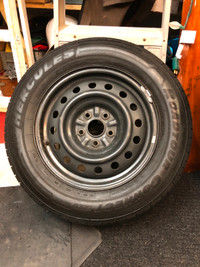 AS NEW.  Only  2500 Km.  4  ALL SEASON TIRES ON RIMS. 215/65R16