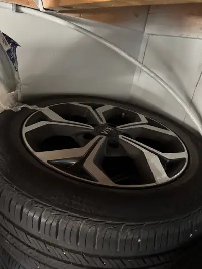 Four used tires are available, ready for a new vehicle. They're mounted on stylish alloy rims featur...