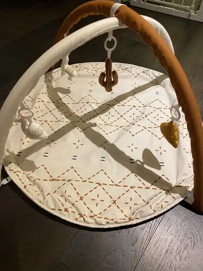 Selling a Lovevery Play Gym in good condition. This play gym features a variety of developmental zon...