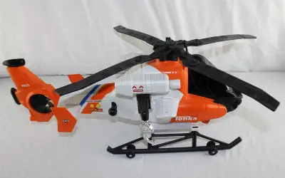 Offering a Tonka Toy Coast Guard Helicopter for $45.00 and a Tonka Toy Security and Saving Truck Ban...