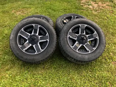 Selling a set of 4 rockstar 2 rims in good shape with studded winter tires 265 60 R18 about 50% trea...
