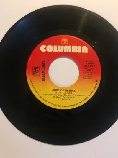 I'm offering a used Billy Joel 45 RPM record featuring the song "Code of Silence". This record is fr...