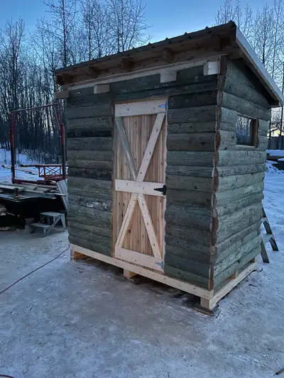 Storage shed made from rough cut cedar and pine. 5 ft wide by 8 ft long and 8 Ft front wall / 7 ft t...