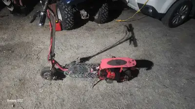 This gas-powered scooter features a compact, maneuverable design, perfect for getting around easily...