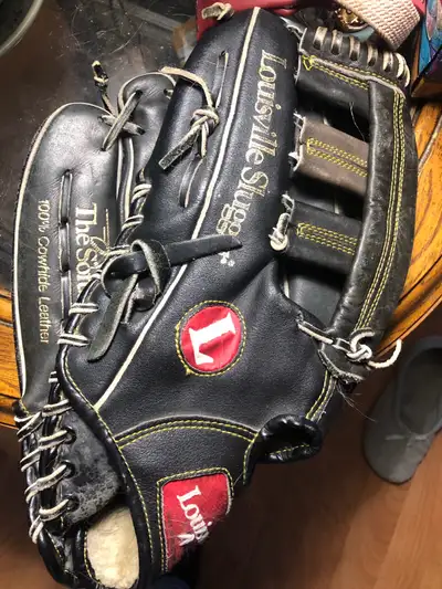 This is a Louisville Slugger The SoftBaller glove, crafted from 100% cowhide leather, perfect for ba...