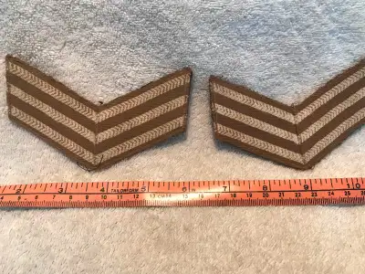 In used condition a pair of WW2 Canadian/British Army Sergeant’s Stripes, appear to been removed fro...