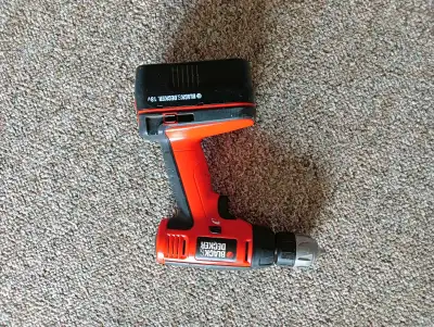 Black and decker drill with battery. Works well, out of power though