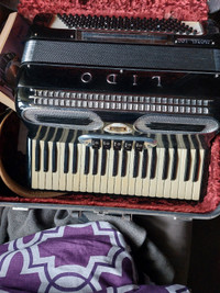 Accordian with music stand and books