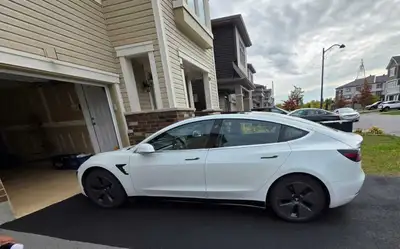 Sleek white Tesla Model 3 2020 Year (Late September model so technically 2021 model) with very low m...