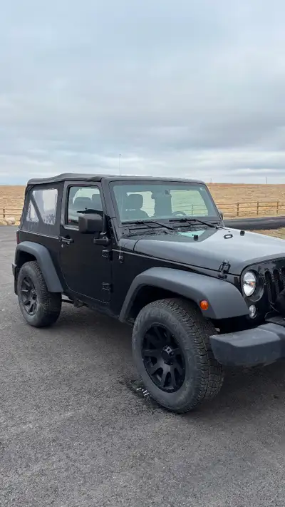 Soft top. Second owner. Garaged and maintained. 8000 Warn winch. Summer and winters on alloy. Good r...