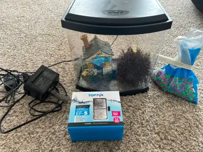 Includes tank, filter and cartridges, aquarium gravel. just add water and a fish.