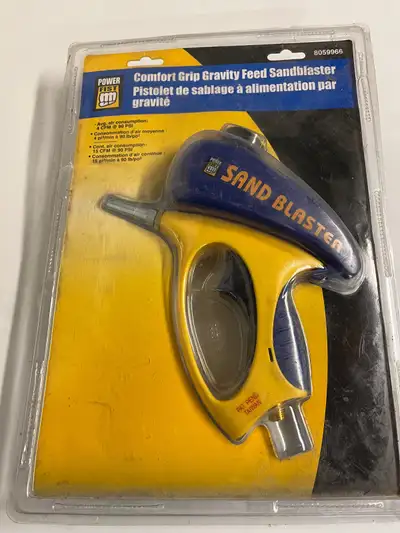 New, in original sealed packaging, a PowerFist comfort grip, gravity feed sandblaster for use with a...