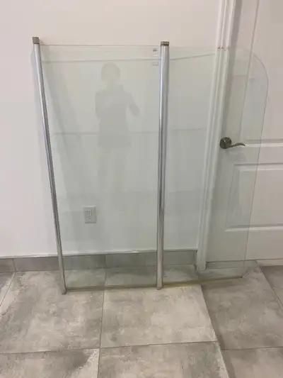 Bathroom shower glass door. The tub shower glass measures 55 1/4" in height and pivots and when exte...