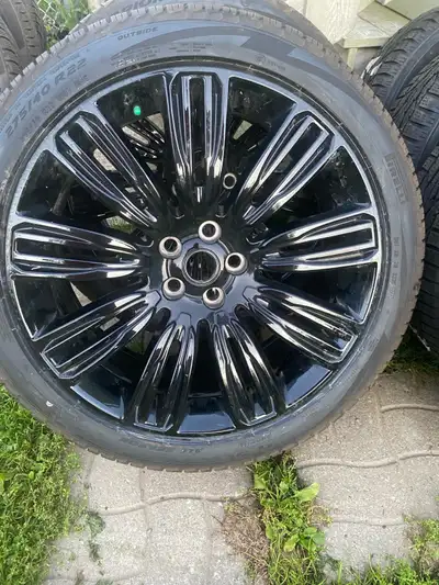 A set of 4 Perrelli All Season Tires on really nice Land Rover Aluminum Rims missing the center caps...