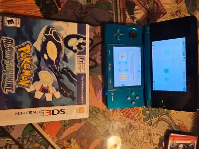 Green 3DS with pokemon alpha sapphire with case and scribblenauts (cart only). It'd been sitting in...