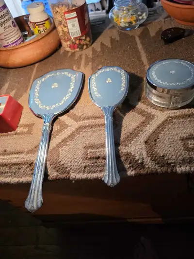 Adorn your space with this charming vintage vanity set, featuring a hand mirror, hairbrush, and trin...