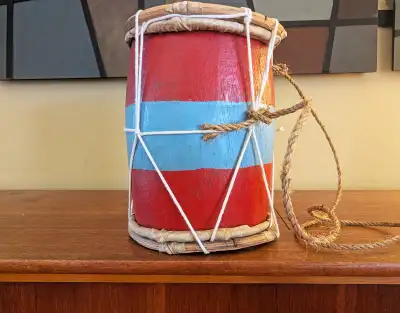 The two-headed tambora drum is a mainstay of Dominican Merengue music, played with a hand-and-stick...