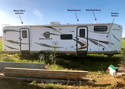 34’ Ultra Lite Travel Trailer Model WRLT3006WK 2 slide-outs, sleeps 9, power awning, master bedroom...