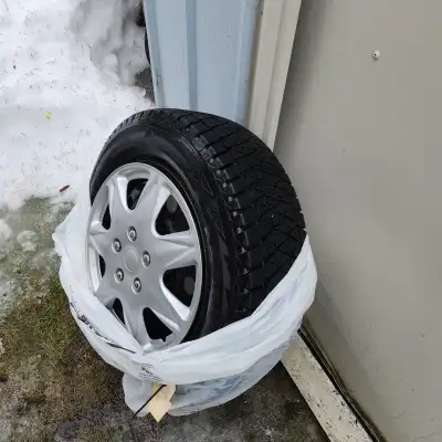 Dodge caravan Bridgestone Blizzak winter tires on steel rims with hubcaps set of 4 like new used one...
