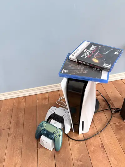 ps-5 with 2 games and 2 controllers, View more