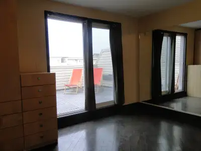 Large and newly renovated third-floor suite with hardwood floors, a large balcony, and plenty of nat...