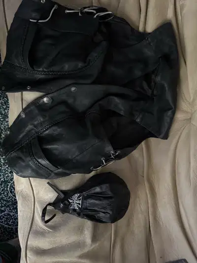 These are a pair of black leather chaps. Perfect for motorcycle riding. These are in used condition,...