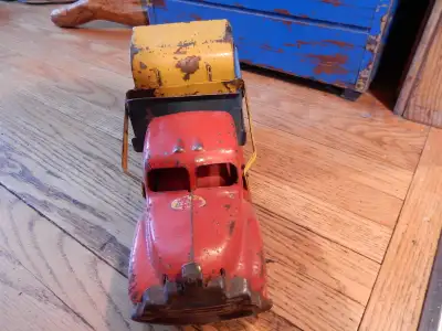 Vintage to dump truck with loader. The box lifts up and the loader will dump in the box. About 14 in...