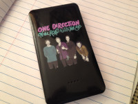 Portable phone charger.7000mAh... One direction on the road agai
